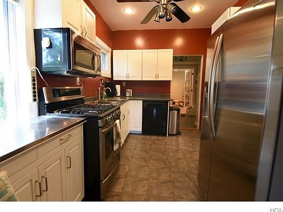 Kitchen leads to dining room and family room or den.  Half bath with Japanese toilet on main level and door to yard.