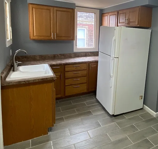 Butler's pantry and laundry area next to kitchen. Washer and dryer included.