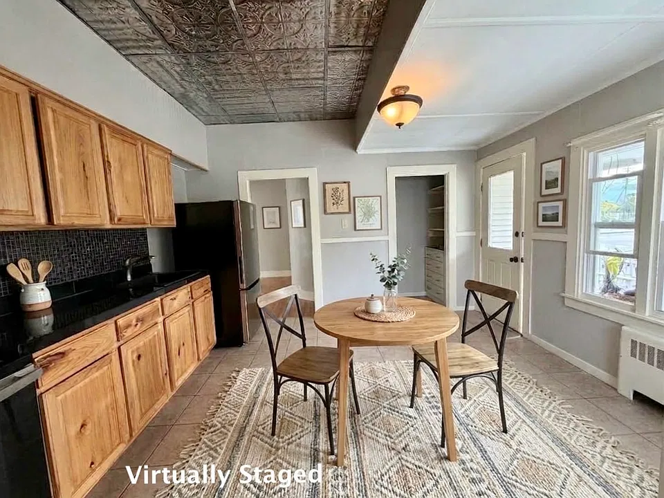 Kitchen and dining area (vitrtually staged)