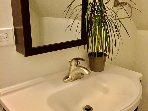 Bathroom with updated vanity and storage beneath the sink