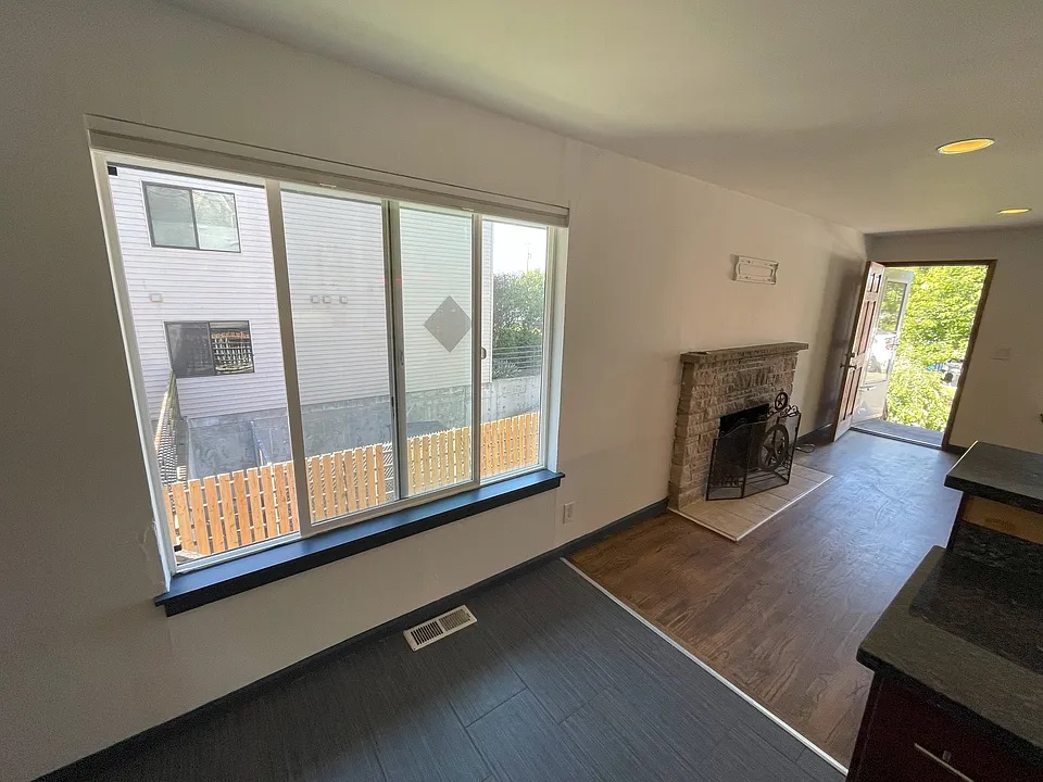 Side window adjacent to the kitchen, offering light to the living area as well.