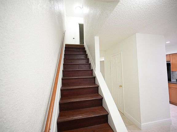 Going up to the stairs to the 2 bed and one bath