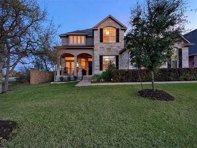 Beautiful stone and stucco two-story home on corner lot.