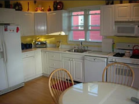 Kitchen includes dishwasher, microwave, fridge and gas oven.