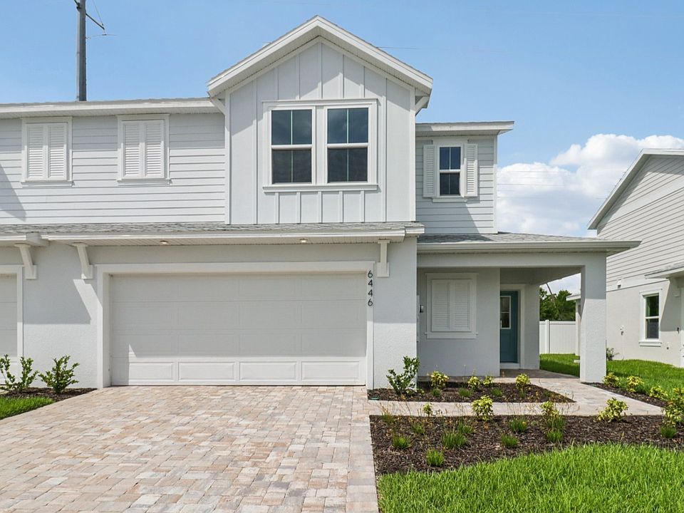 Exterior Monterey End Townhome by DRB Homes - Cyrene at Harmony in St Cloud FL