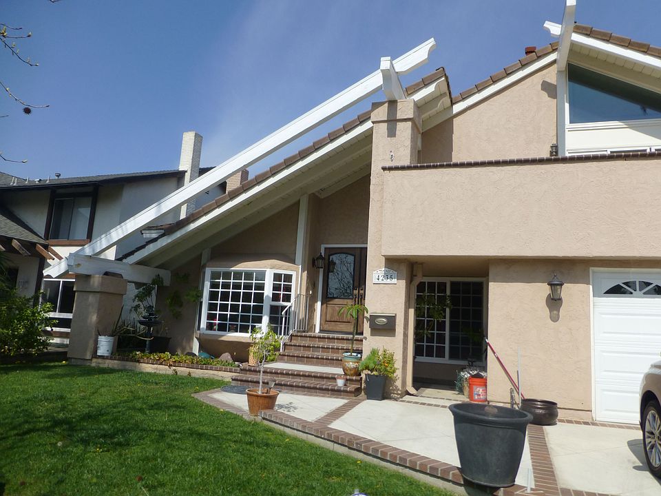 Great curb appeal w/ hardscaped driveway and private lawn an