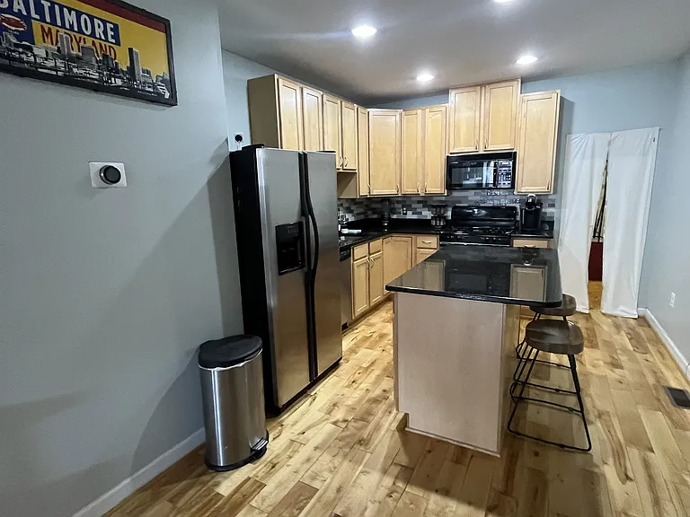 Kitchen area with applicances and storage