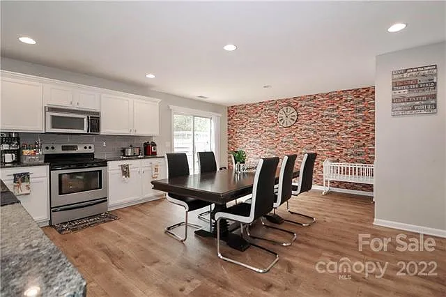 Light and bright cook's kitchen; older photo (accent wall has been changed to green)