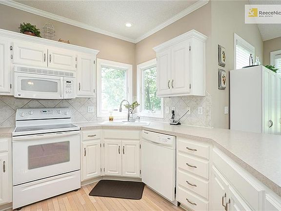 Kitchen Windows look out to Tree Line