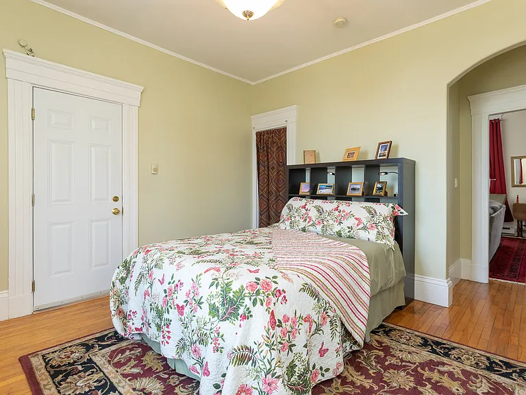 Bedroom with queen bed and second means of egress.