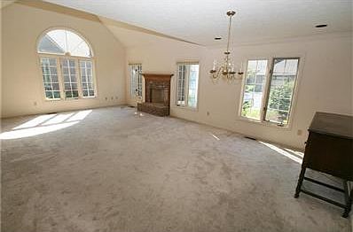 Spacious great room and dining room with tons of light.