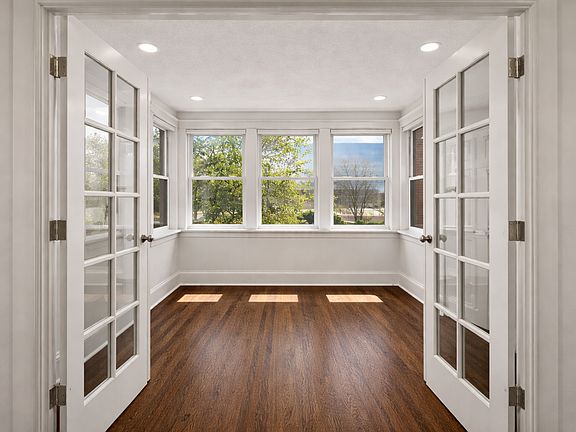 Front bedroom.

Brand new energy efficient windows. Custom light filtering cellular blinds (raised in picture). Closet.

Upgraded recessed can lights