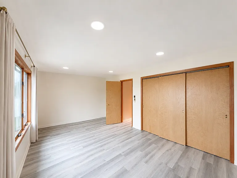 Bright primary bedroom with generous closet space