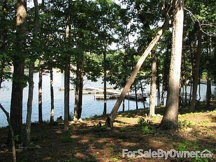 Rear view..porch/decks...lakeside
						:
						lower patio is under porch..adjoins family room area