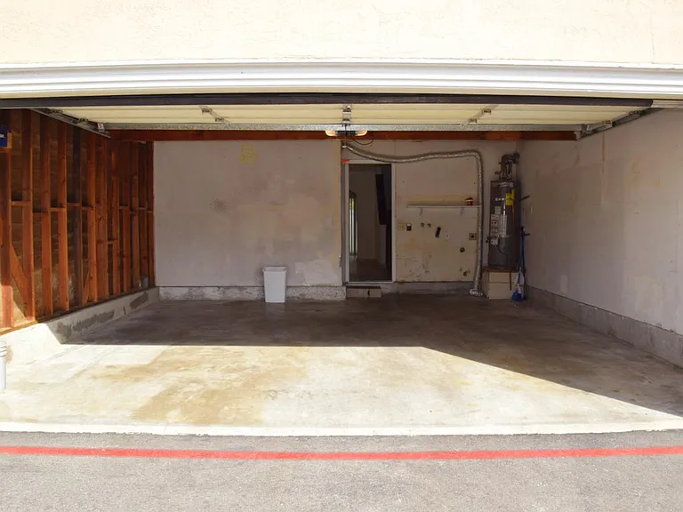 Large two car garage with storage overhead and hookups for washer and dryer. Dryer can be gas or electric.