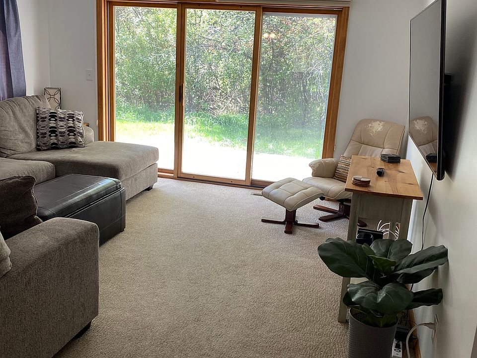Living room and sliding door to back patio and yard.