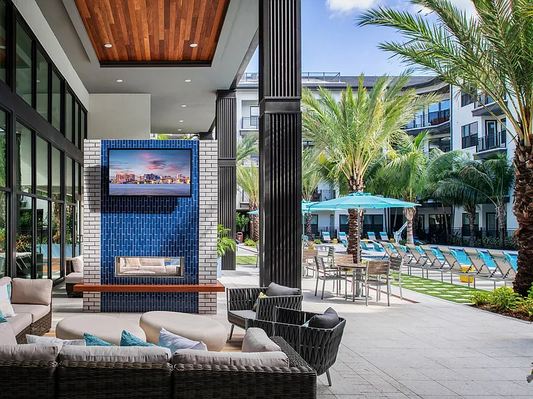 Outdoor lounge area with TV