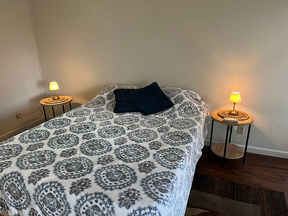Queen size bed with linens, night stands and Split A/C