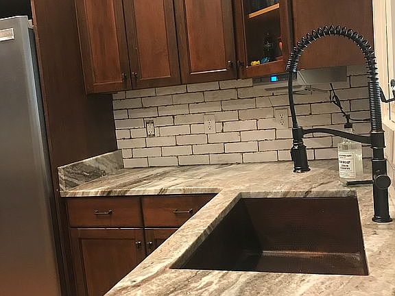 Copper sink, granite counter