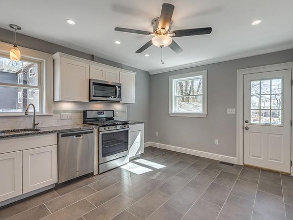 Large kitchen with tile floor