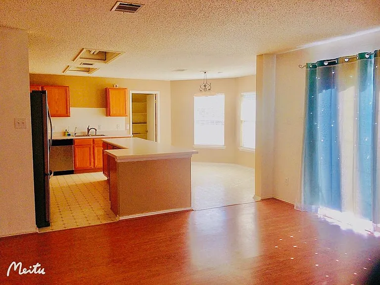 Continue walking, there is the kitchen and formal dining room.