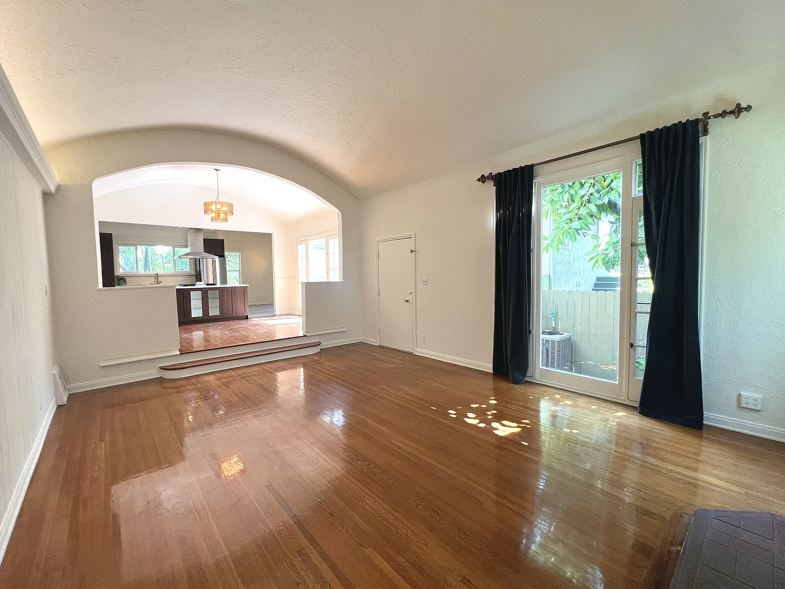 Living room view toward dining/kitchen