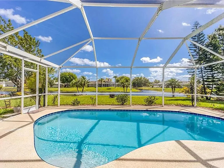 pool and lanai, view of the lake