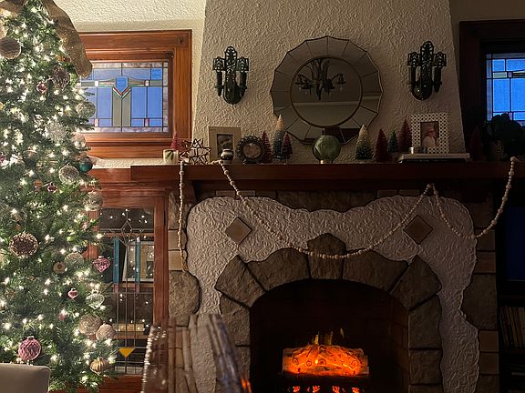 Can't you see yourself relaxing in this beautiful space? Artificial fireplace has outlet inside for ceramic log unit.
