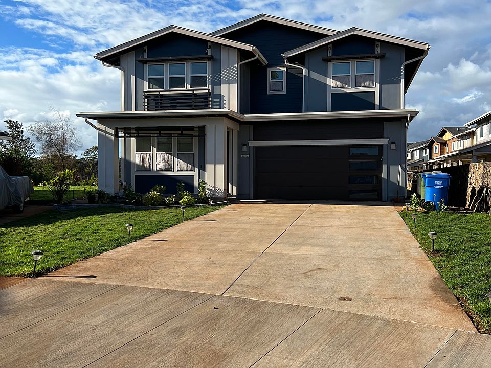 Front exterior of house featuring long driveway and landscaping (new fence was added along property after photo was taken).