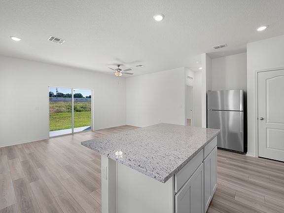 A spacious entertainment space with luxury vinyl flooring