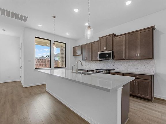 Kitchen. Sample product photo. Actual exterior and interior selections may vary by homesite. Photo m