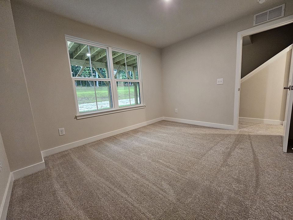 First floor bedroom, window open to the back of the house and next to stairs