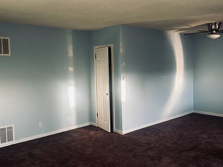 Living room with dinette & ceiling fan
