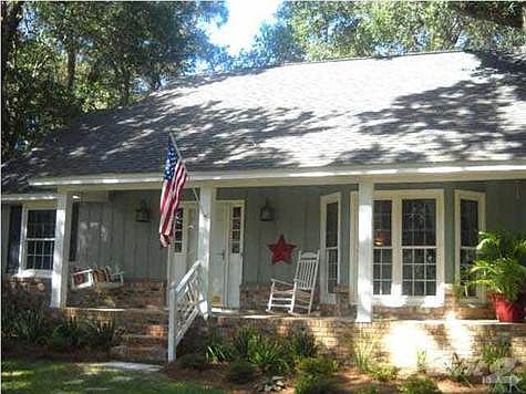 Covered porch with swing and room for chairs