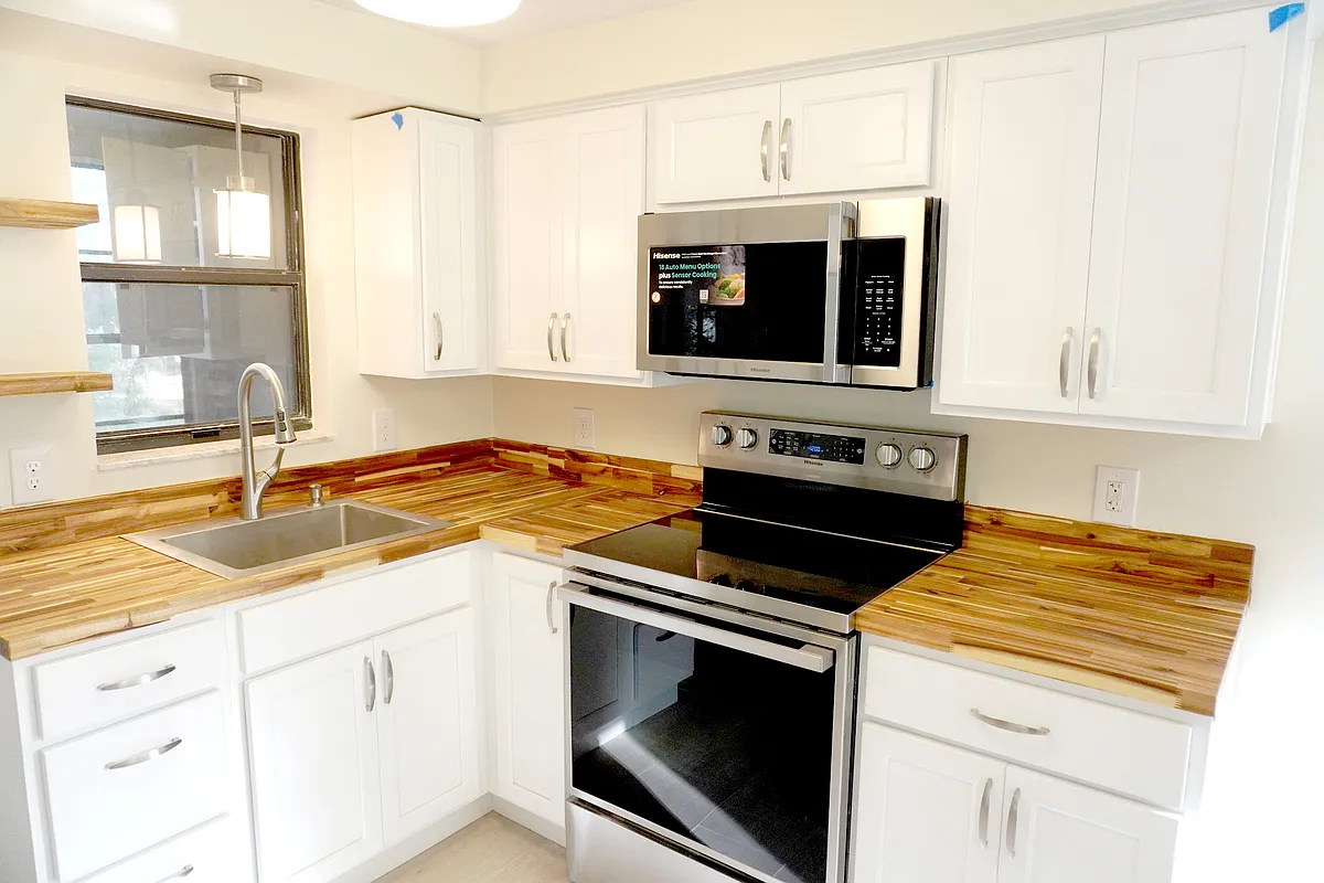 New kitchen appliances and cabinetry. Deep well stainless sink. Butcher block counter tops. - 33 63rd St