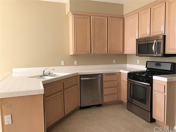 Kitchen with Stainless Appliance & Refrigerator