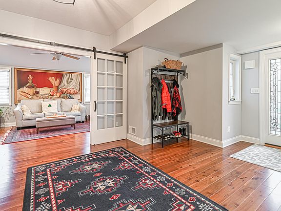 Entry area and Living Room behind sliding French Doors