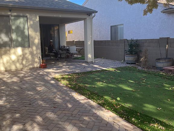 Covered patio with concrete pavers installed in Herringbone pattern