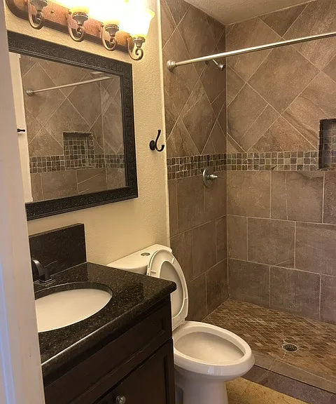 2nd bathroom with granite and time amenities