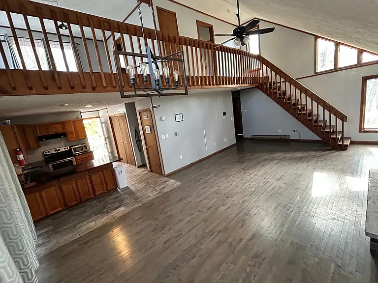Entire view of kitchen, dinning, living room and loft space