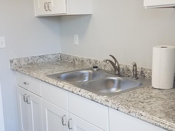 Kitchen features new fixtures and appliances, new cabinetry and granite countertops.
