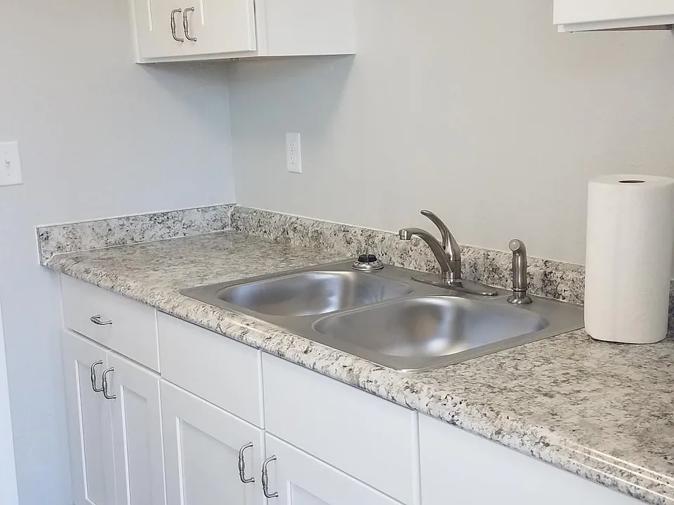 Kitchen features new fixtures and appliances, new cabinetry and granite countertops.