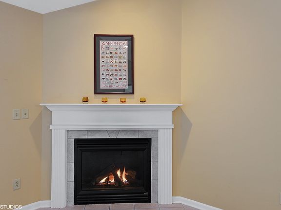 Gas log fireplace with gas start. Warm and lovely! A great addition to this room!