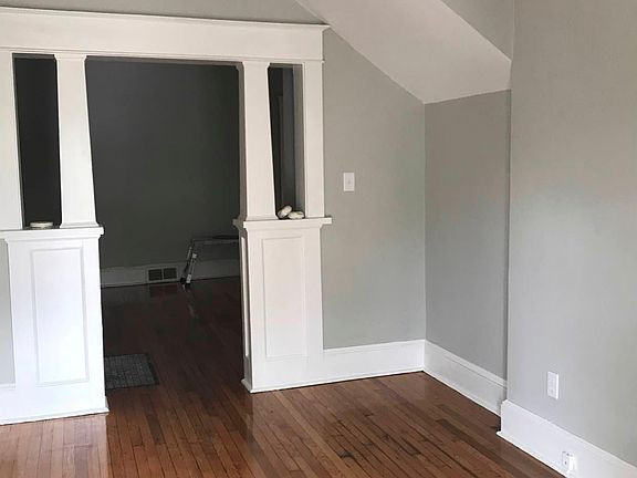 Foyer w/ Beautiful Hardwood Floors and Designer Lighting.