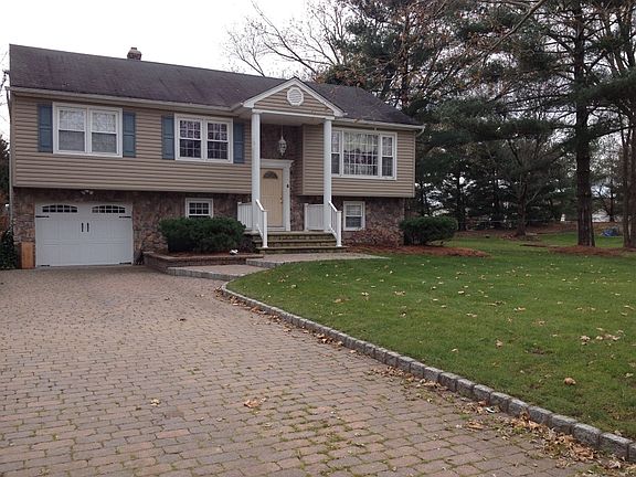 Oversized PAVED driveway can easily fit 4 cars