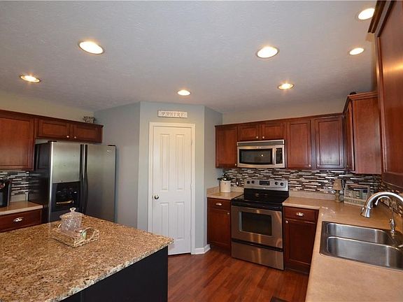 Kitchen boasts granite center island with seating!