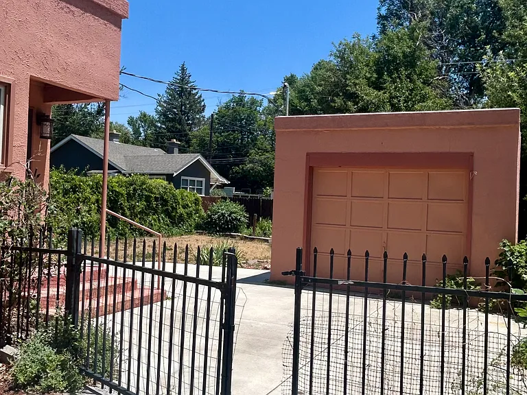 Garage, driveway, and fence