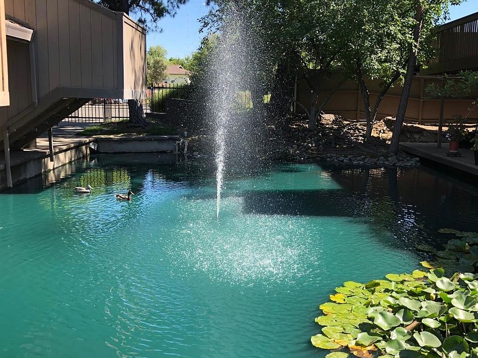 Beautiful waterways meander through the property with a deck to the water way it is a serene and peaceful setting.