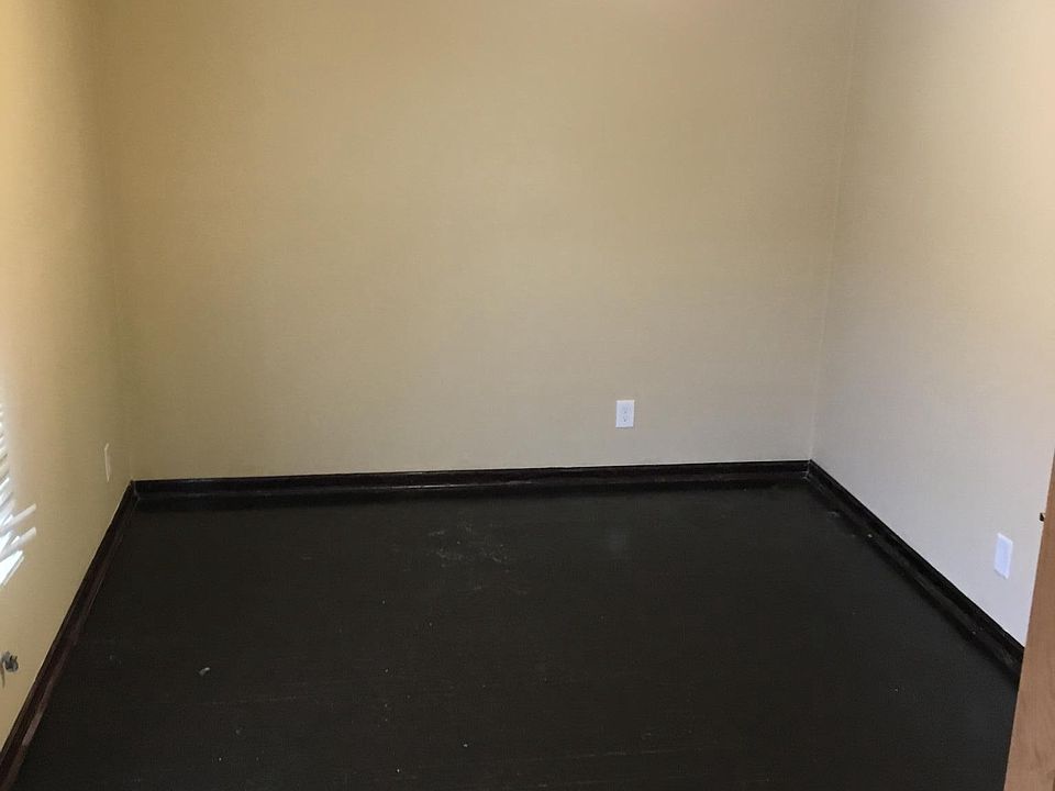 Bedroom with hardwood flooring
