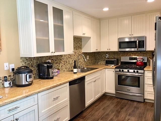 Upgraded Kitchen with granite, stainless steel appliances.